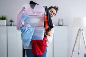woman-with-pile-of-clothes