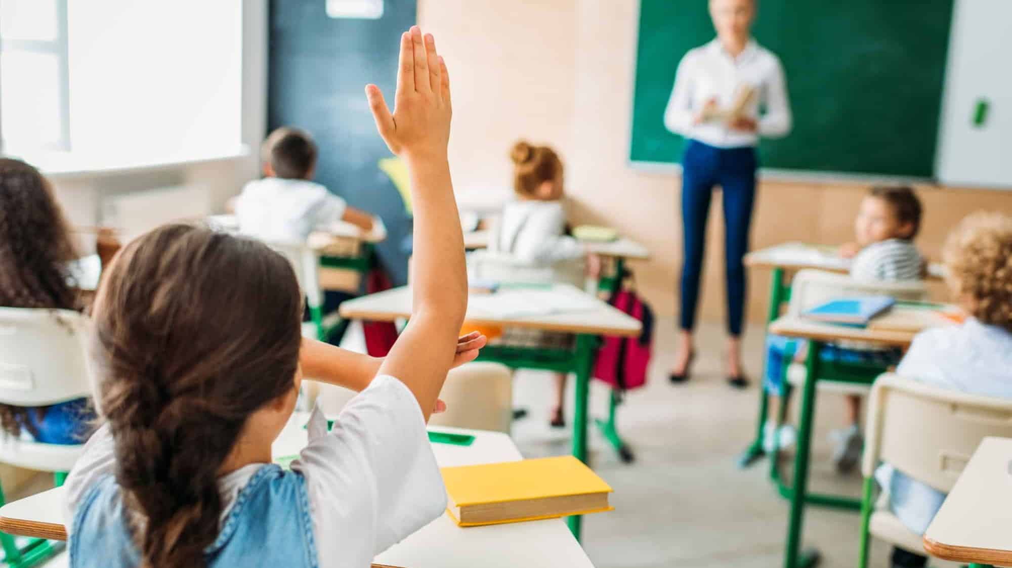 Houston school - child raising hand