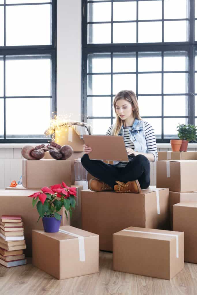 Woman checking the web for Apartment moving