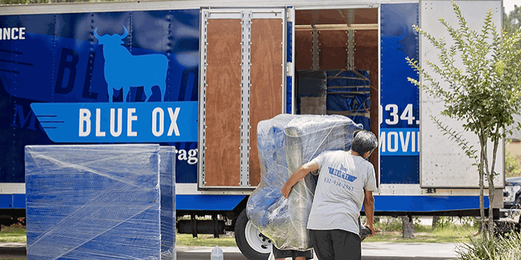 Blue-Ox-team-loading-a-truck-with-couch