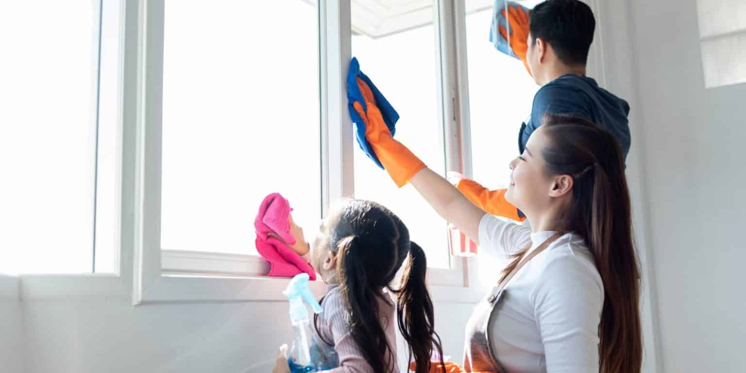 Family cleaning home during move