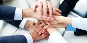 working team holding hands